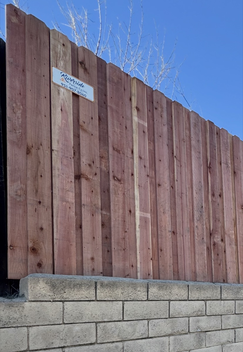 Riverside Fence Co branded wood fence installation